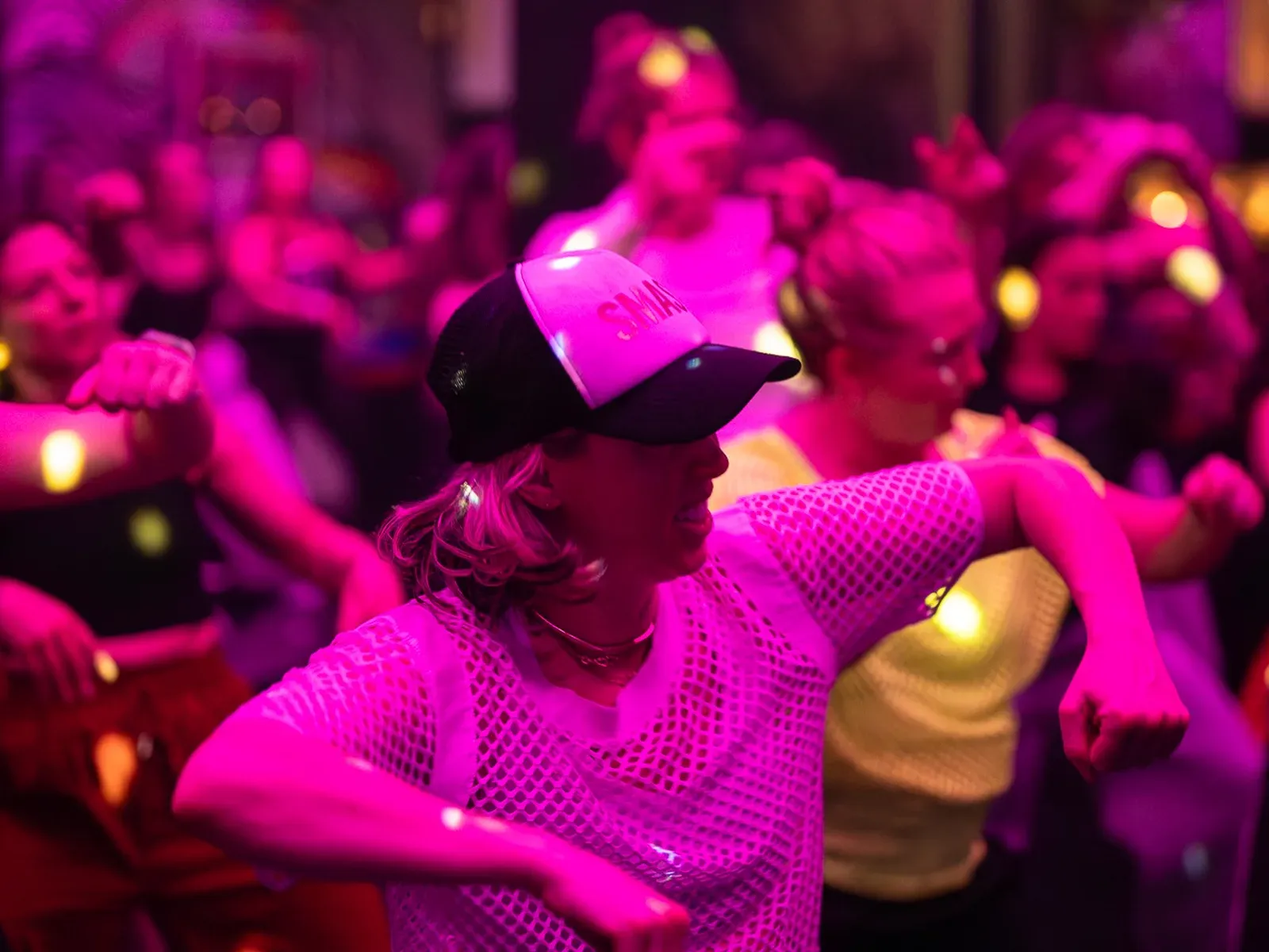 Adult dancers close up in the middle of a C3 Dance Fit class